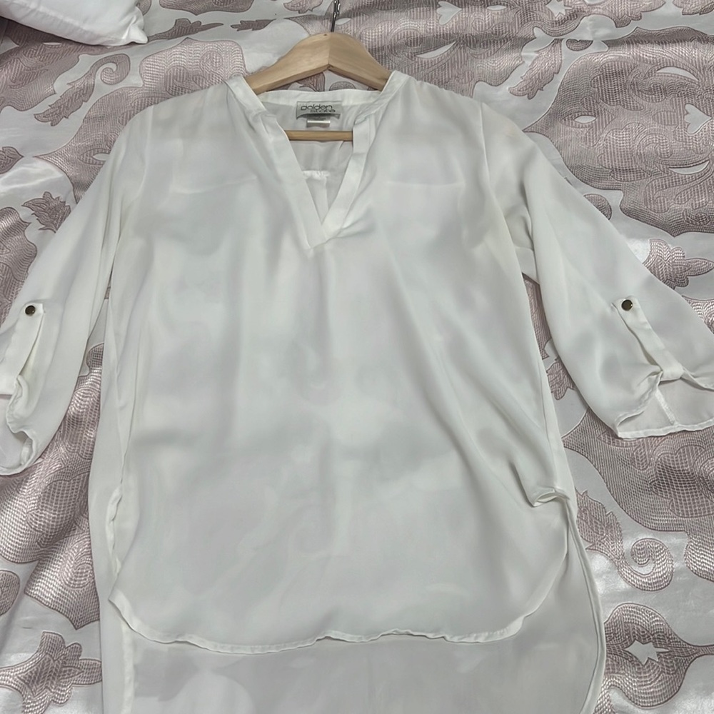 White blouse with gold buttons